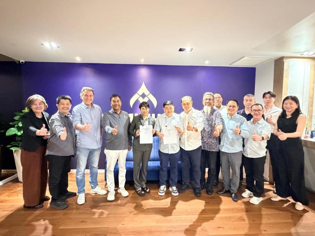 Members of the respective companies posing for a picture at the signing Ceremony Held in Kuala Lumpur, Malaysia.
